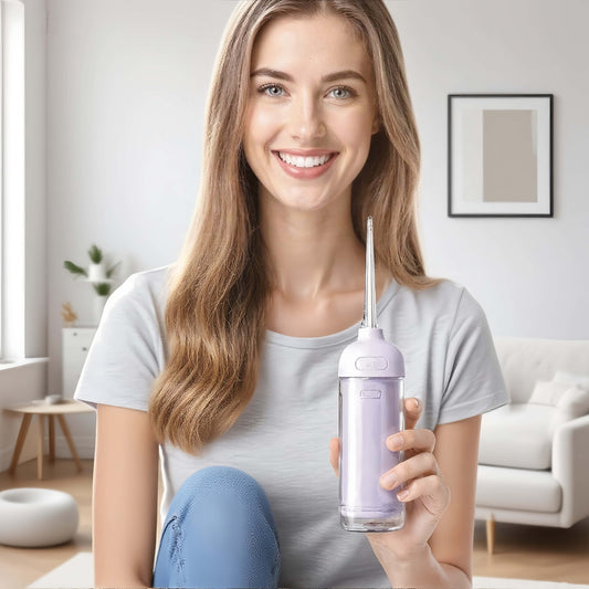 Woman Using Orateeth Handy Water Flosser at Home