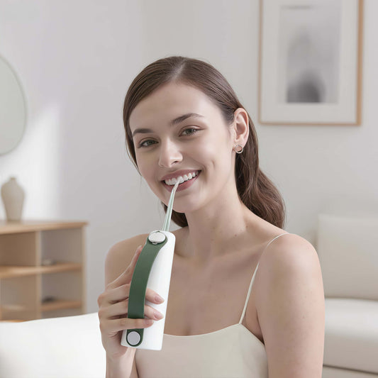 Woman Using Orateeth W10 Flosser at Home