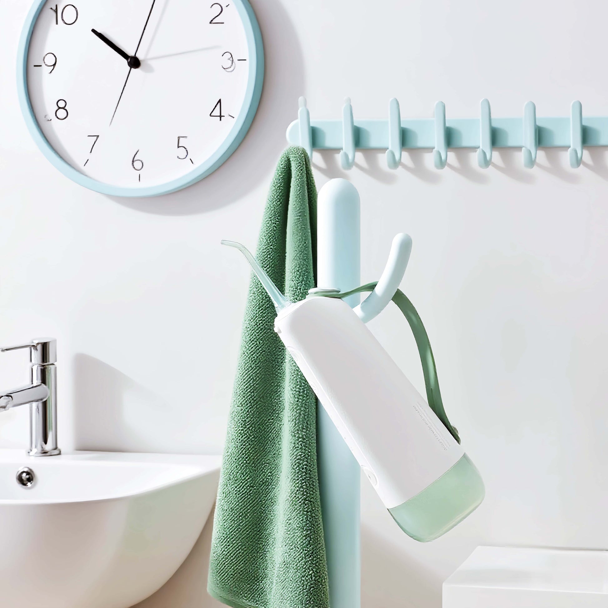 Orateeth W10 Flosser in Bathroom with Clock