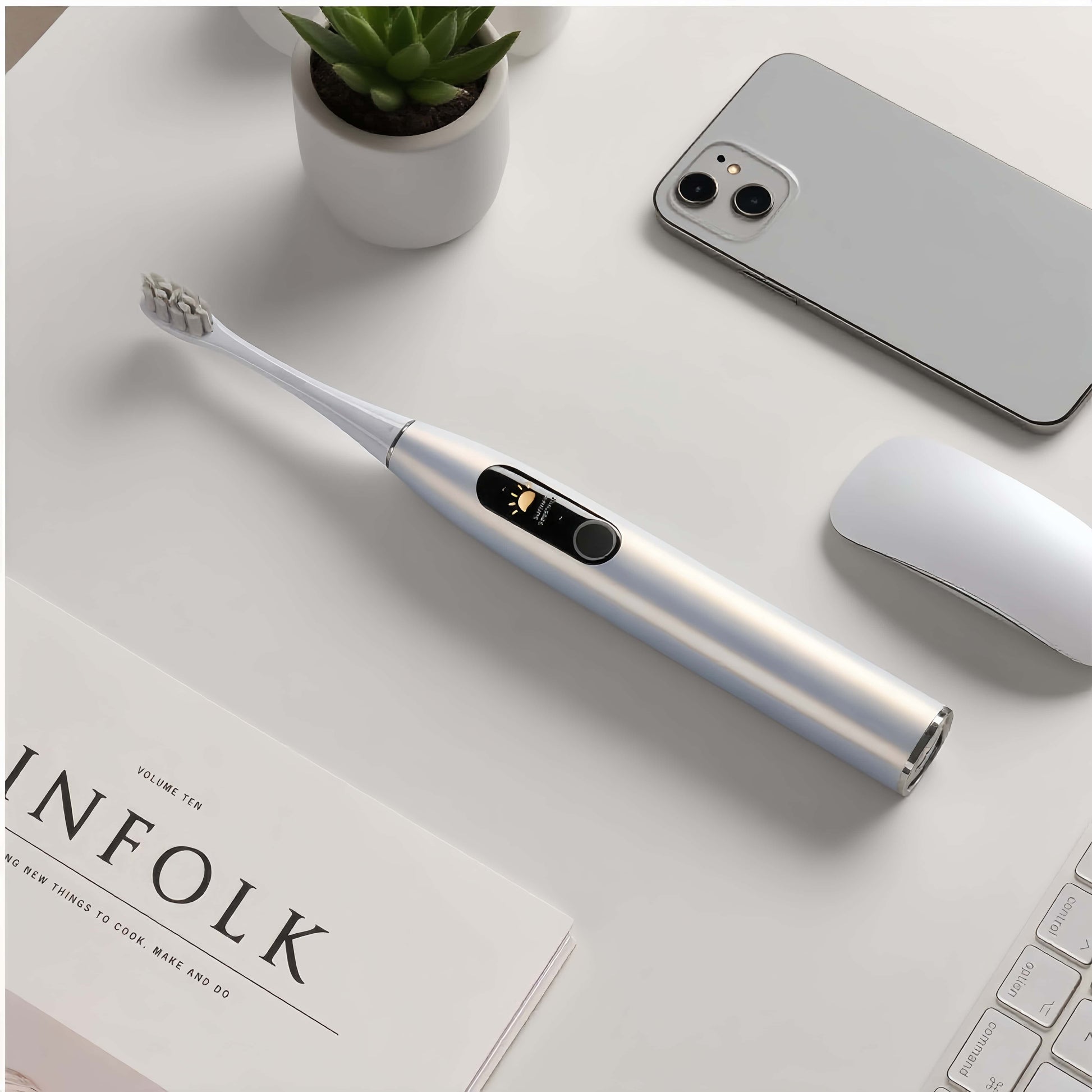 Orateeth X Pro Toothbrush on Desk with Phone