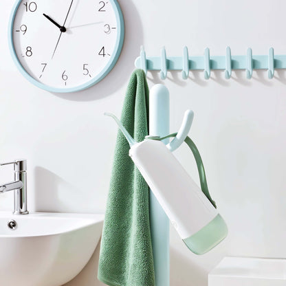 Orateeth W10 Flosser in Bathroom with Clock